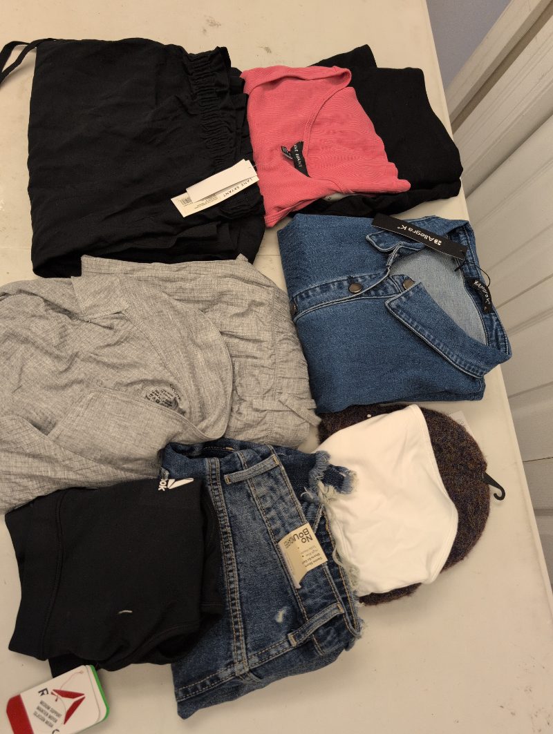 Lot of 10 different size clothing items sold price at auction in Canada